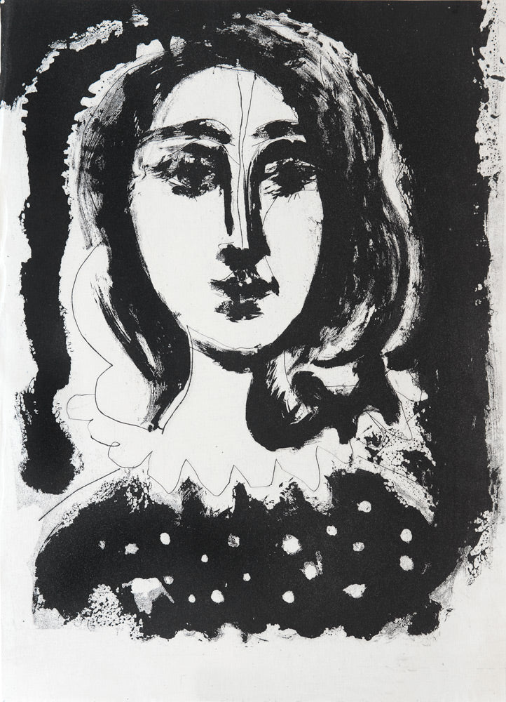 Face of a woman against a black ground