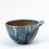 Set of Two Faceted Bowls With Lugs